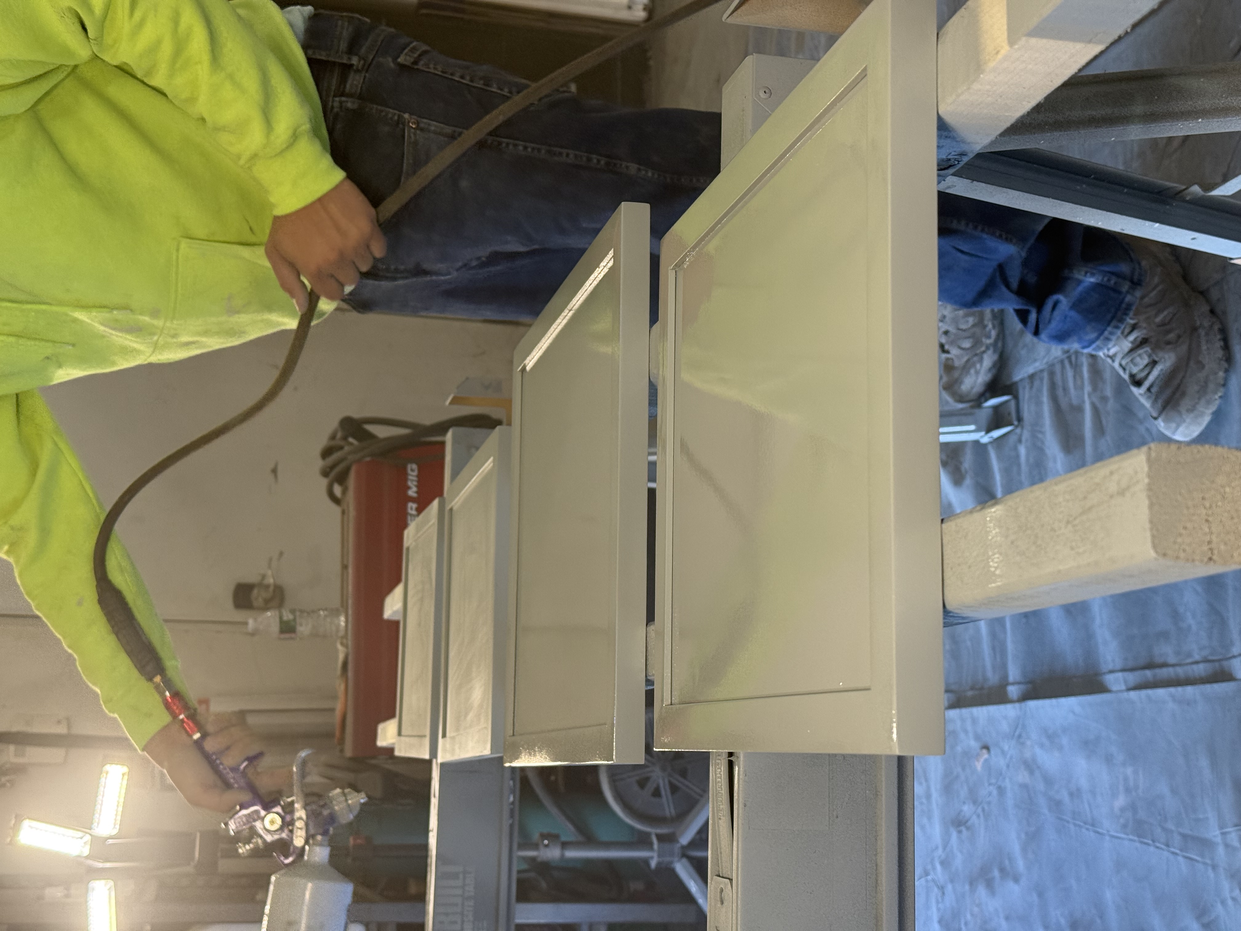 Professional spray painting in controlled booth